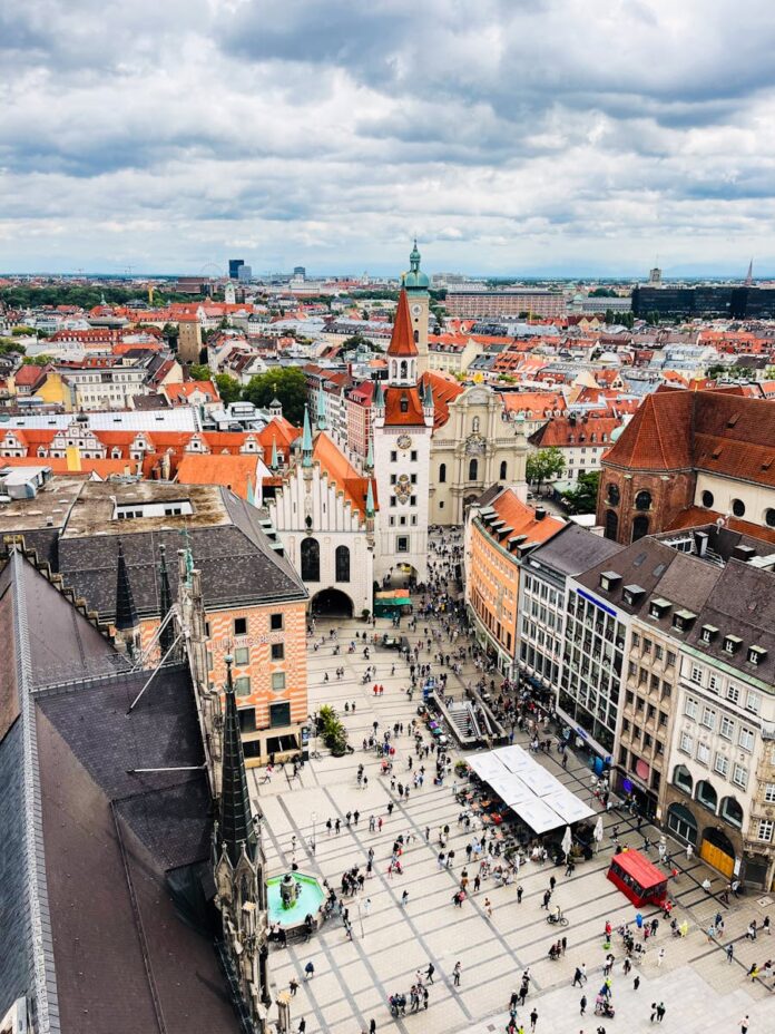 A vibrant aerial view of Munich's Marienplatz square, showcasing architecture and urban life.